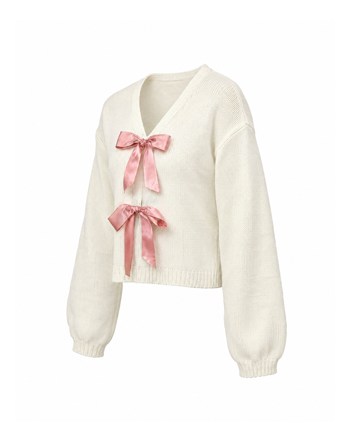 Ivory cropped V-neck sweater with two pink satin bows, three-quarter view showing the dropped shoulder and ribbed cuff
